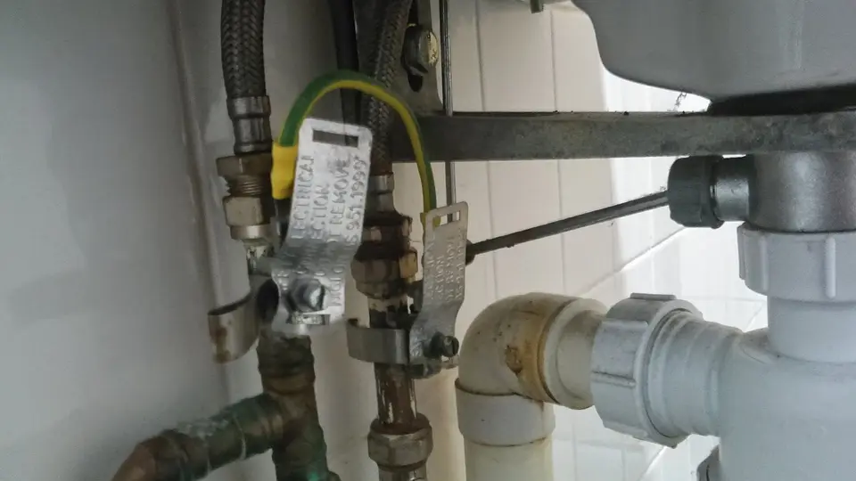 Licensed plumber working on a residential repair
